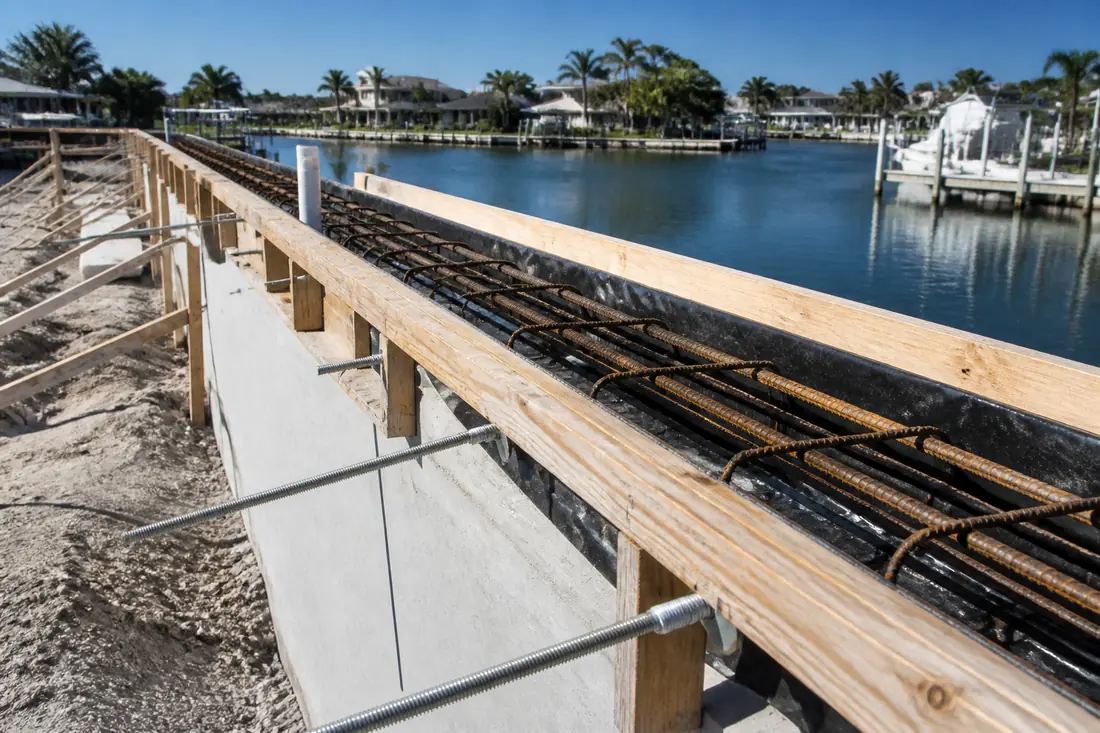 Reinforcing steel and tieback rods exposed in an open seawall cap before the pour